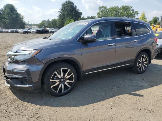 HONDA PILOT TOUR 2021 with VIN 5FNYF6H64MB023673 - Photo from auction