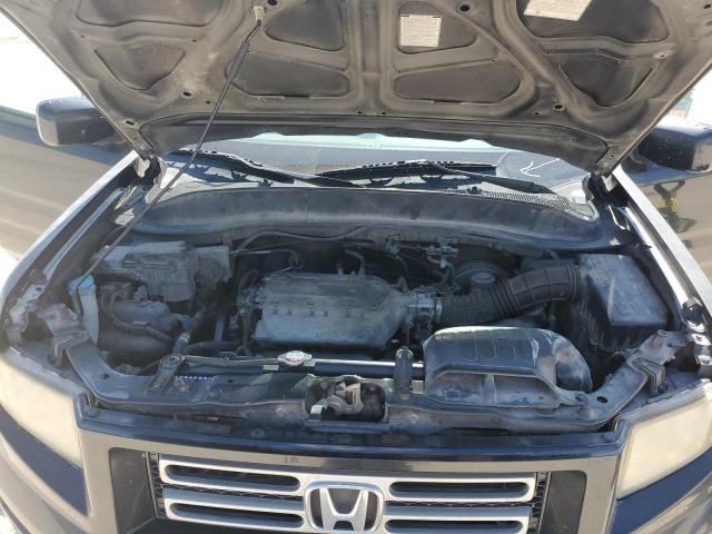 Photo 11 from auction – 2006 HONDA RIDGELINE with VIN 2HJYK16586H566980