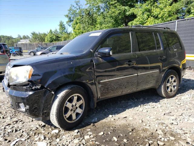 HONDA PILOT TOUR 2011 with VIN 5FNYF4H99BB007769 - Photo from auction
