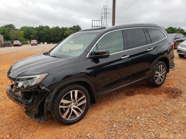 HONDA PILOT TOUR 2017 with VIN 5FNYF5H98HB007521 - Photo from auction