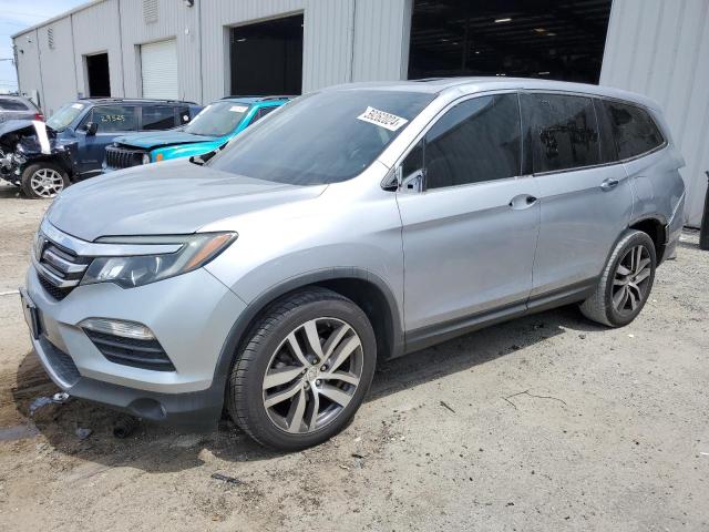 Photo 1 from auction – 2017 HONDA PILOT TOUR with VIN 5FNYF5H90HB045261