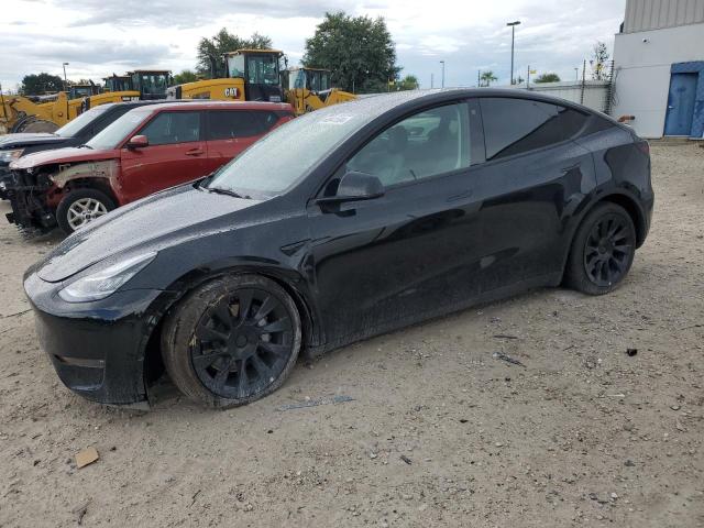 TESLA MODEL Y 2023 with VIN 7SAYGAEE6PF594374 - Photo from auction