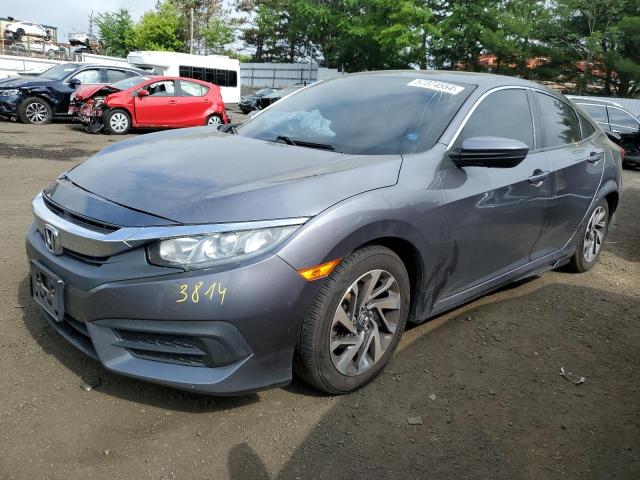 HONDA CIVIC EX 2017 with VIN 2HGFC2F74HH565507 - Photo from auction