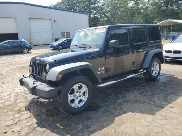 JEEP WRANGLER U 2009 with VIN 1J4GB39169L737151 - Photo from auction