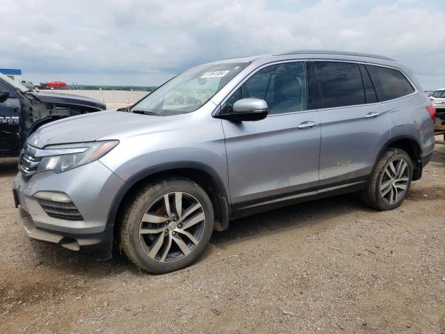 HONDA PILOT TOUR 2016 with VIN 5FNYF6H98GB063138 - Photo from auction