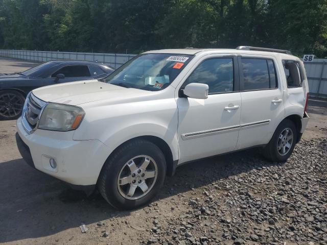 HONDA PILOT TOUR 2011 with VIN 5FNYF4H99BB084576 - Photo from auction