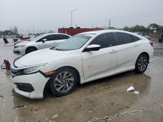 HONDA CIVIC EX 2018 with VIN 19XFC2F70JE030559 - Photo from auction