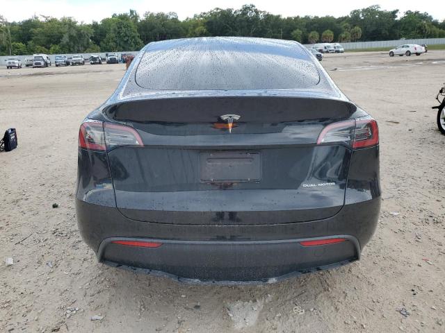 Photo 6 from auction – 2023 TESLA MODEL Y with VIN 7SAYGAEE6PF594374