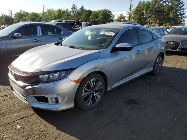 HONDA CIVIC EX 2018 with VIN JHMFC1F34JX041621 - Photo from auction