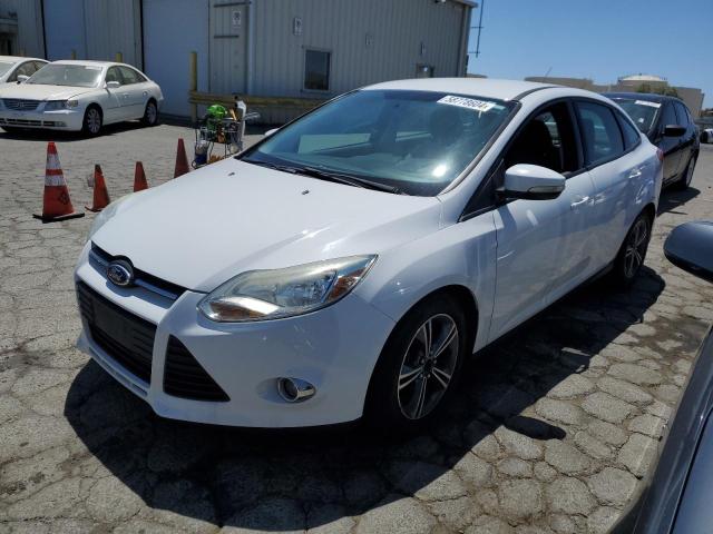 FORD FOCUS SE 2014 with VIN 1FADP3F20EL311799 - Photo from auction