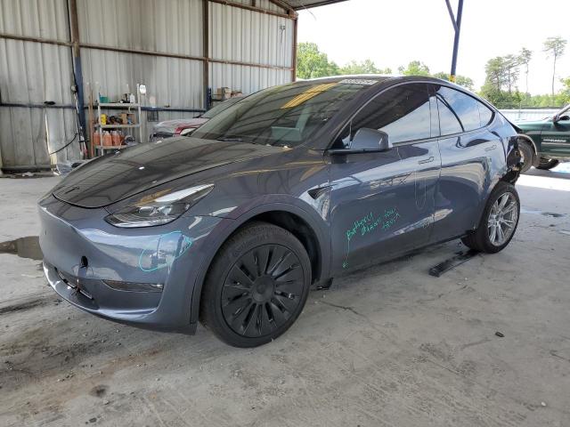 TESLA MODEL Y 2023 with VIN 7SAYGDED6PF944062 - Photo from auction
