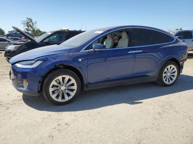 TESLA MODEL X 2020 with VIN 5YJXCBE29LF297996 - Photo from auction