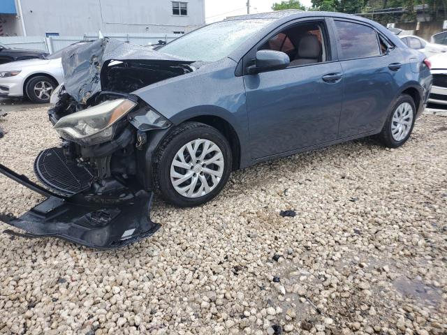 TOYOTA COROLLA L 2014 with VIN 5YFBURHE5EP071032 - Photo from auction