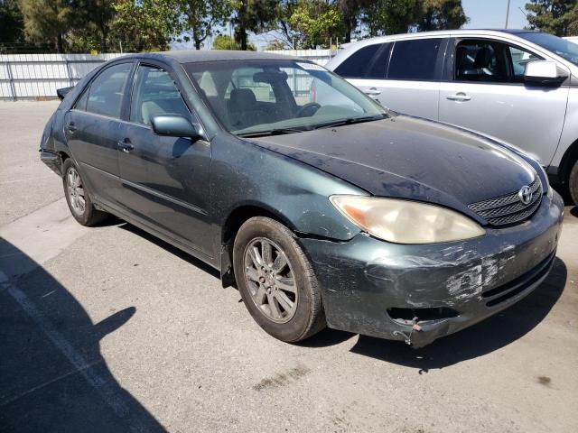 Photo 4 from auction – 2002 TOYOTA CAMRY LE with VIN JTDBE30K120045884