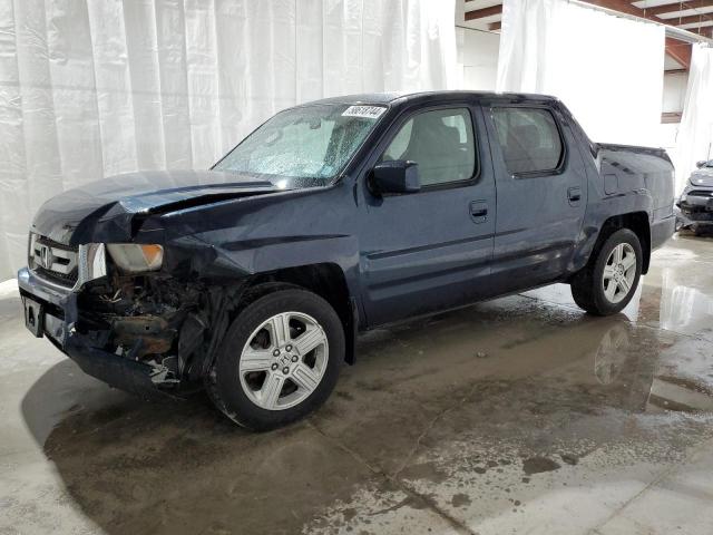 HONDA RIDGELINE 2011 with VIN 5FPYK1F50BB004700 - Photo from auction