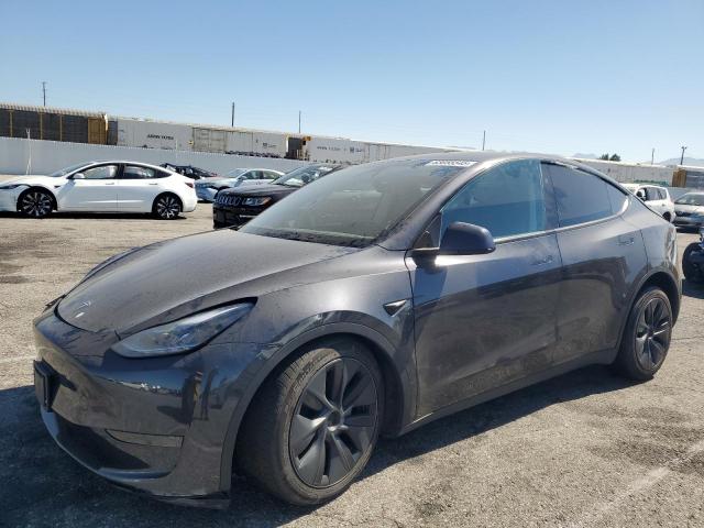 TESLA MODEL Y 2025 with VIN 7SAYGDED3SF242855 - Photo from auction