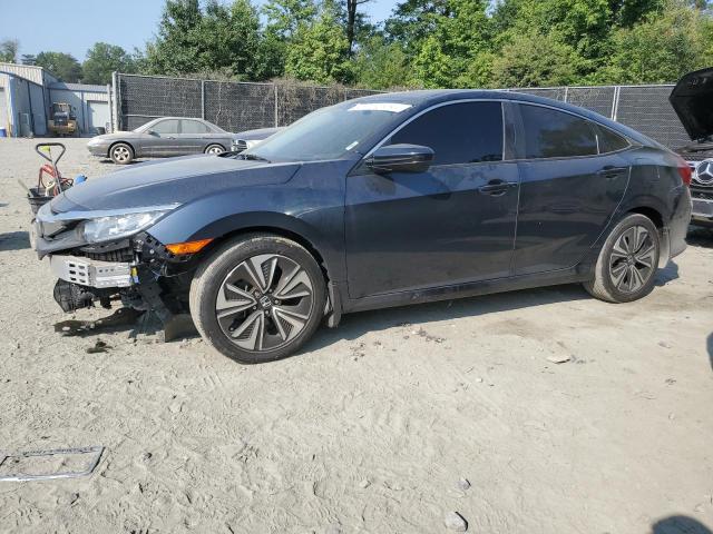 HONDA CIVIC EX 2018 with VIN JHMFC1F36JX015800 - Photo from auction