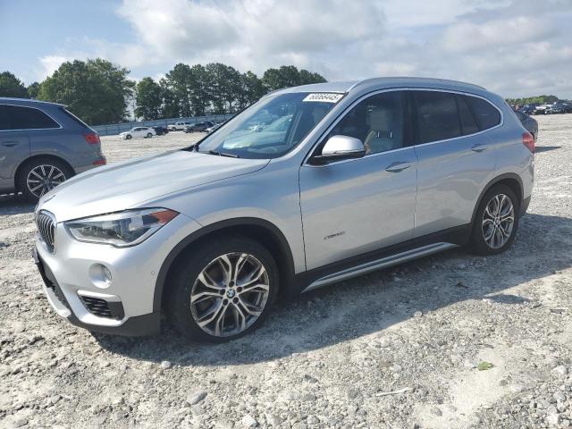 BMW X1 2017 with VIN WBXHT3Z35H4A57457 - Photo from auction