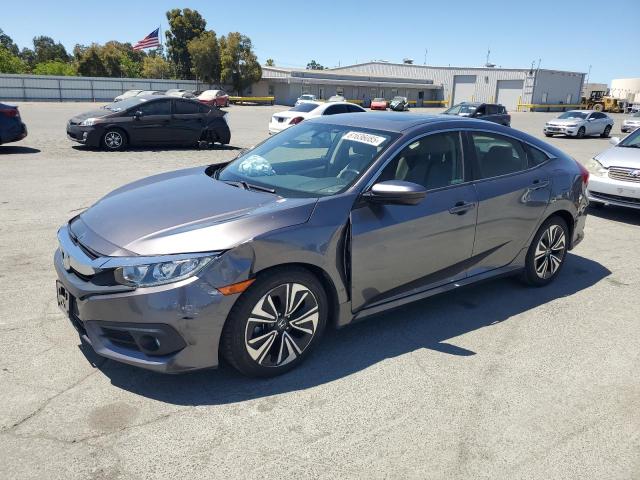 HONDA CIVIC EX 2018 with VIN JHMFC1F37JX009228 - Photo from auction