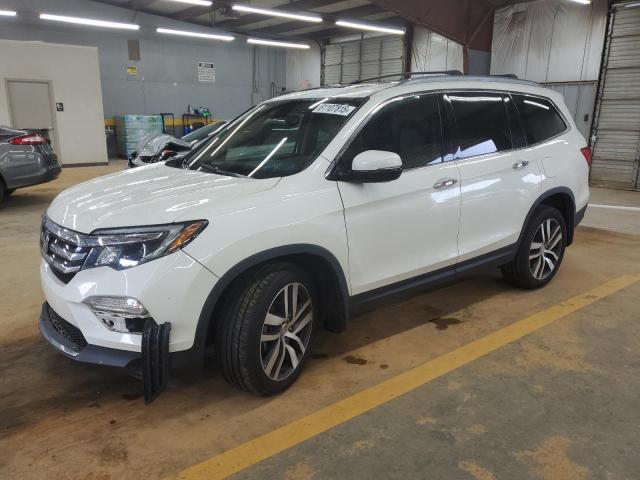 HONDA PILOT TOUR 2018 with VIN 5FNYF6H90JB022803 - Photo from auction