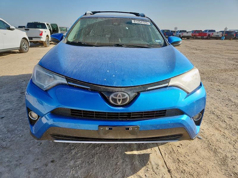 Photo 5 from auction – 2016 TOYOTA RAV4 XLE with VIN JTMWFREV0GJ090482