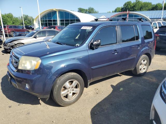 HONDA PILOT EXLN 2011 with VIN 5FNYF4H74BB023022 - Photo from auction