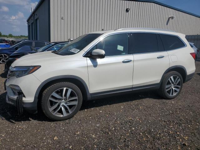 HONDA PILOT TOUR 2018 with VIN 5FNYF6H93JB038624 - Photo from auction