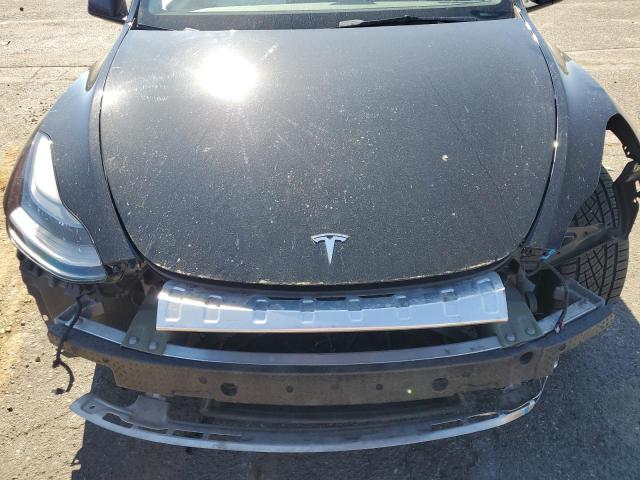 Photo 11 from auction – 2023 TESLA MODEL Y with VIN 7SAYGDEE9PF647134