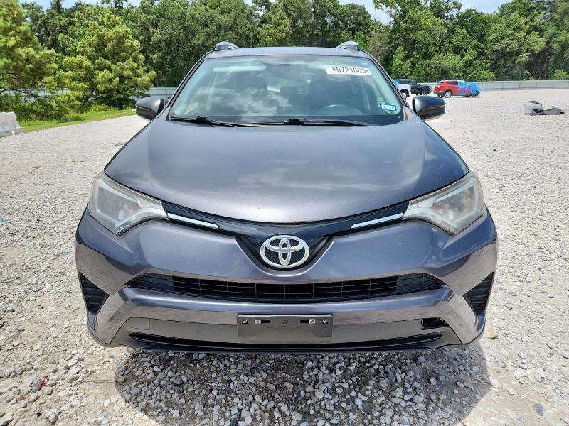 Photo 5 from auction – 2016 TOYOTA RAV4 LE with VIN JTMZFREV6GJ098518