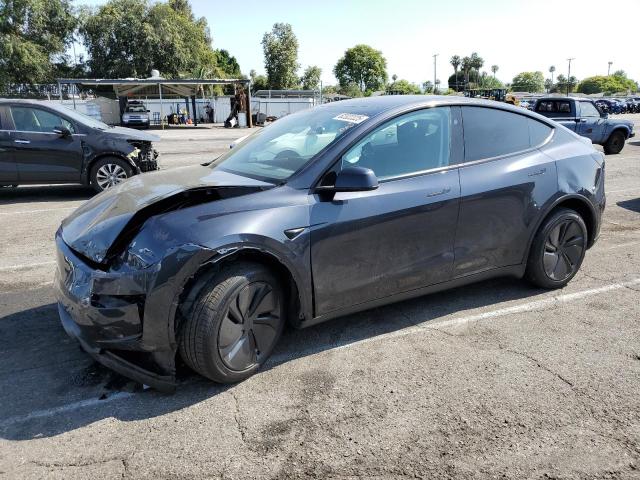 TESLA MODEL Y 2026 with VIN 7SAYGDED6TF381475 - Photo from auction
