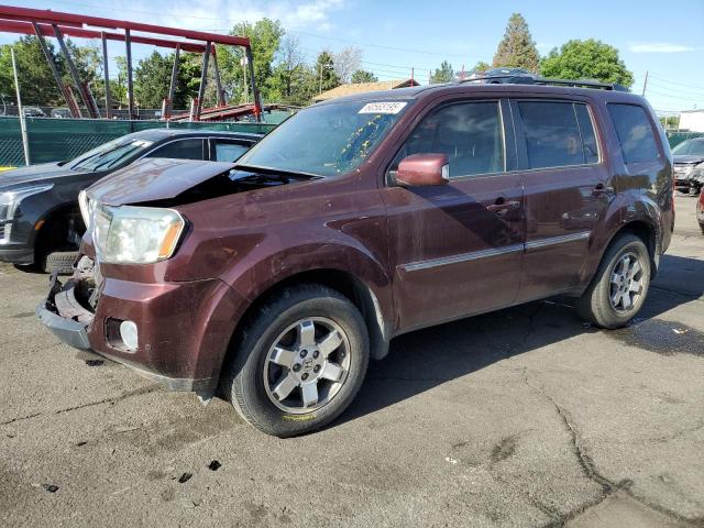 HONDA PILOT TOURING 2011 with VIN 5FNYF4H90BB039560 - Photo from auction