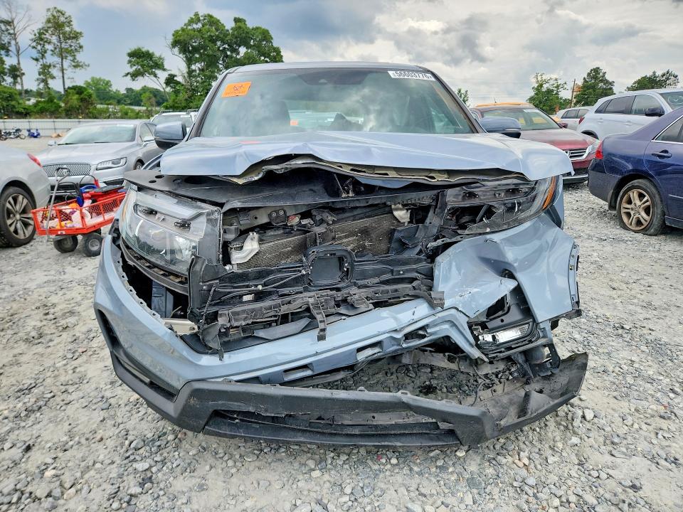 Photo 5 from auction – 2023 HONDA PASSPORT with VIN 5FNYF8H57PB019253