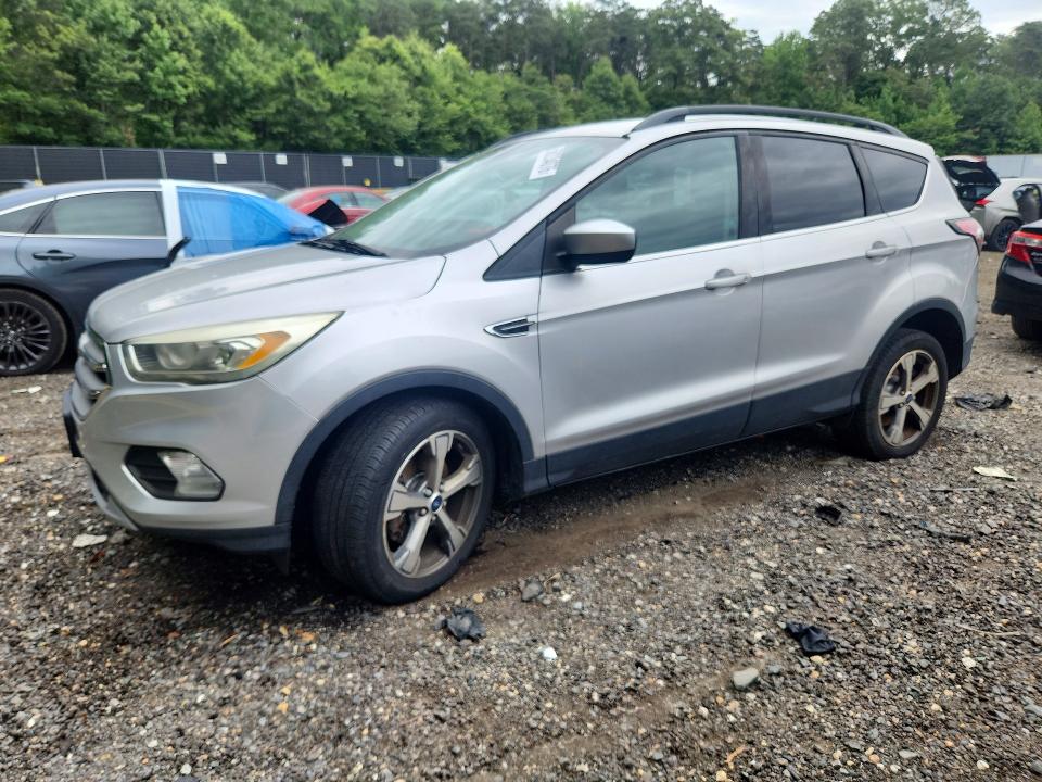 FORD ESCAPE 2017 with VIN 1FMCU9GD1HUC16678 - Photo from auction