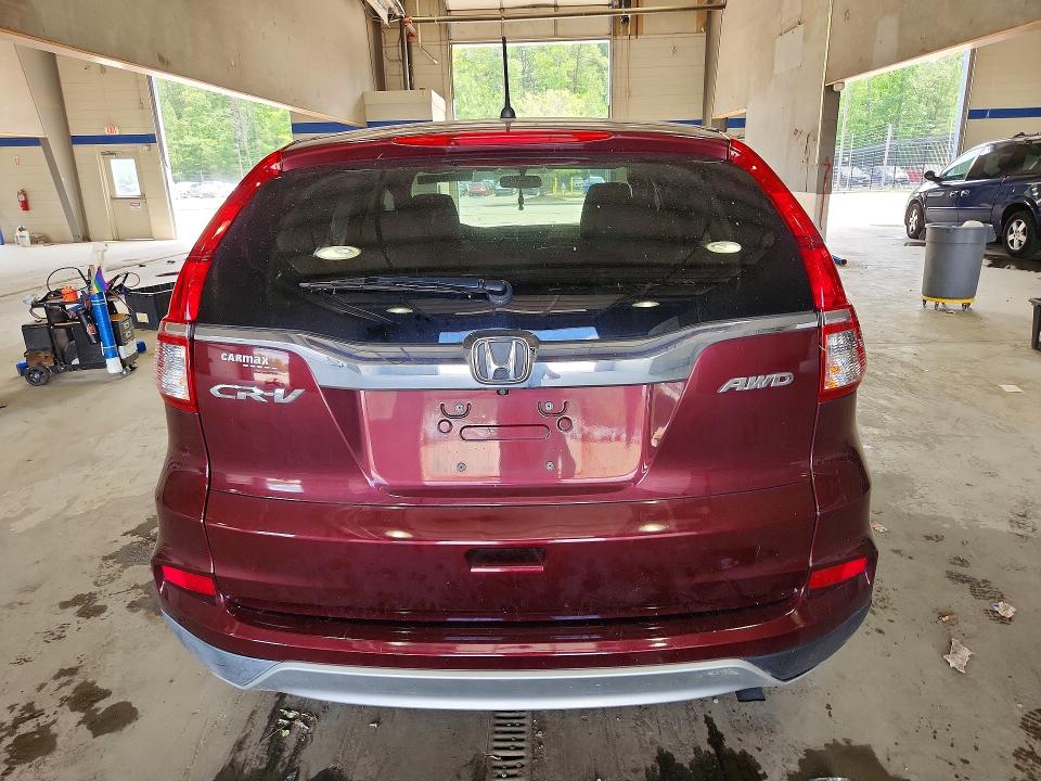 Photo 6 from auction – 2015 HONDA CR-V with VIN 2HKRM4H54FH615679