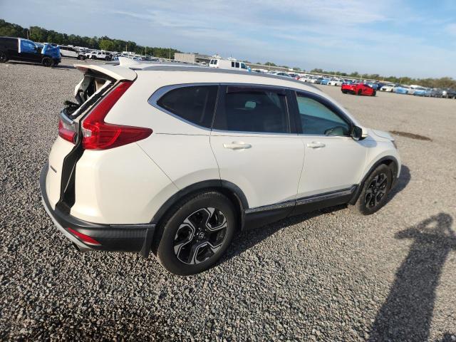 Photo 3 from auction – 2017 HONDA CR-V with VIN 5J6RW1H99HL016412