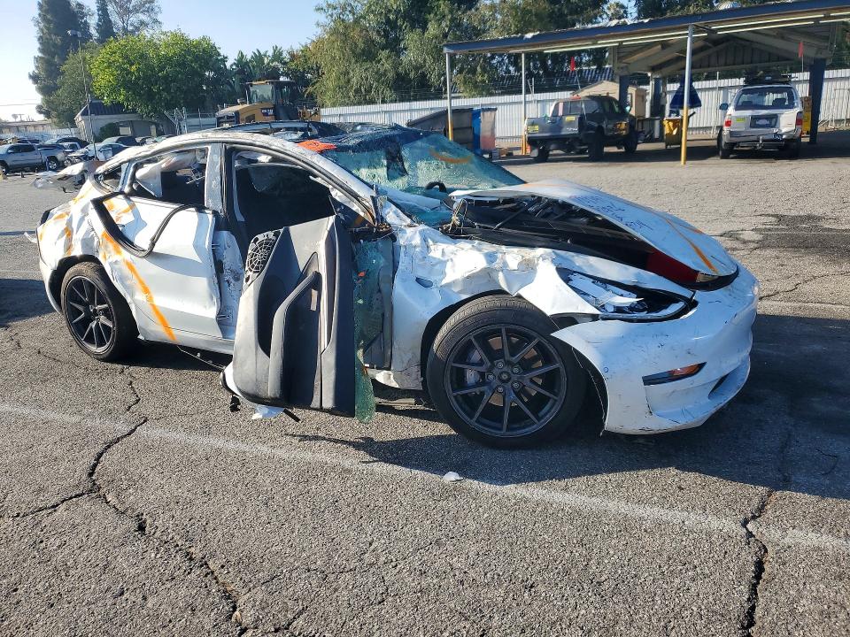 Photo 4 from auction – 2022 TESLA MODEL 3 with VIN 5YJ3E1EB6NF297069
