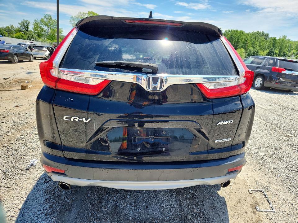 Photo 6 from auction – 2018 HONDA CR-V with VIN 7FARW2H99JE061729