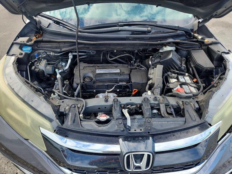 Photo 12 from auction – 2015 HONDA CR-V with VIN 2HKRM4H74FH707182
