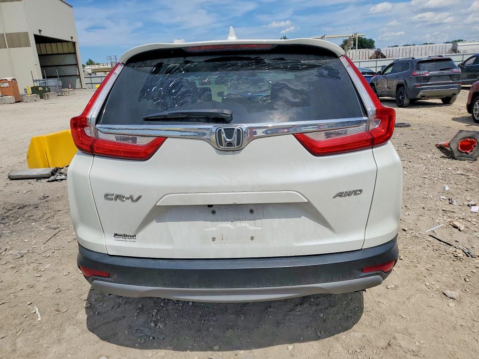 Photo 6 from auction – 2017 HONDA CR-V with VIN 5J6RW2H55HL031010
