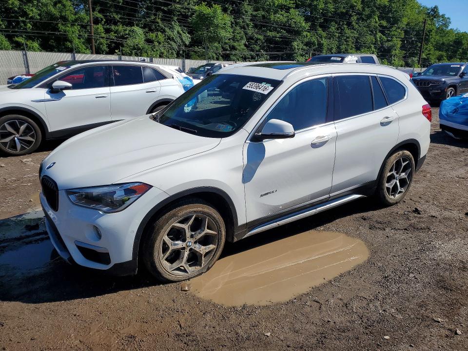 BMW X1 2017 with VIN WBXHT3C31H5F71132 - Photo from auction
