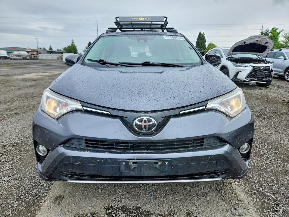 Photo 5 from auction – 2018 TOYOTA RAV4 with VIN JTMRFREV1JD226461