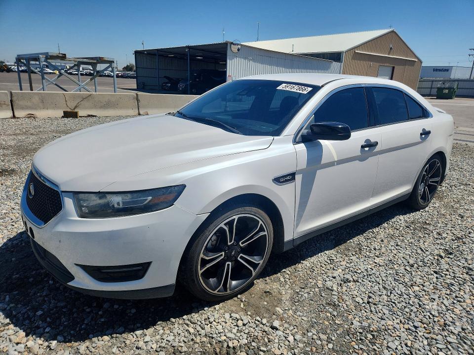 FORD TAURUS 2014 with VIN 1FAHP2KT8EG129383 - Photo from auction