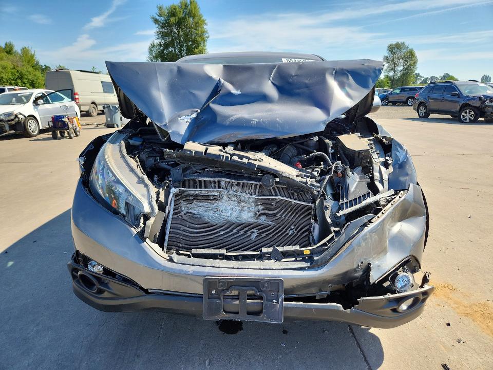 Photo 5 from auction – 2013 HONDA CR-V with VIN 2HKRM4H5XDH669579