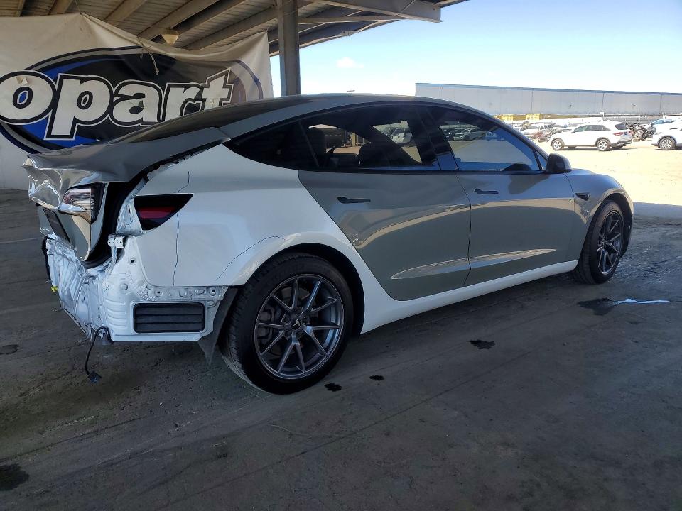 Photo 3 from auction – 2021 TESLA MODEL 3 with VIN 5YJ3E1EA6MF928800