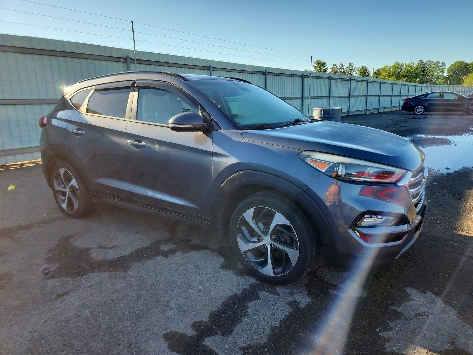Photo 4 from auction – 2016 HYUNDAI TUCSON with VIN KM8J3CA21GU095907