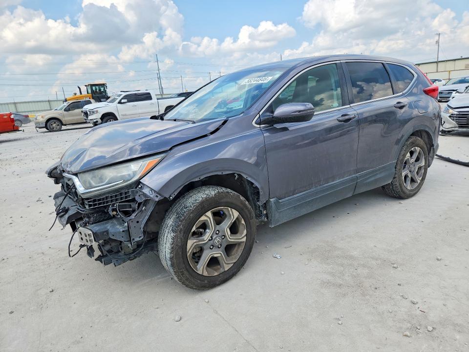 Photo 1 from auction – 2018 HONDA CR-V with VIN 2HKRW2H52JH673538