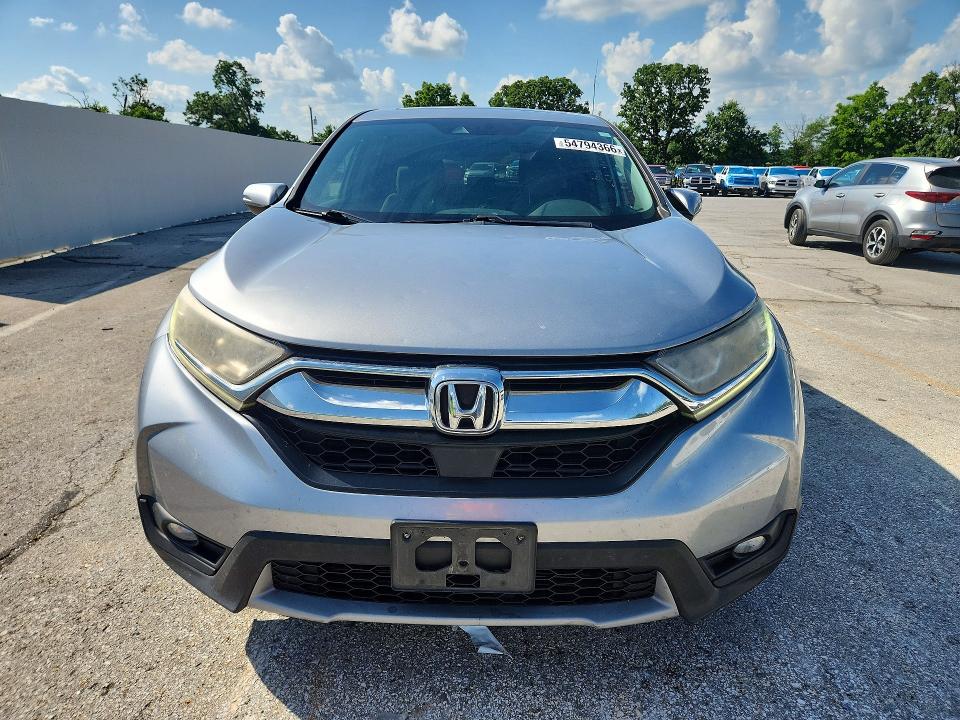 Photo 5 from auction – 2018 HONDA CR-V with VIN 5J6RW1H58JA009305