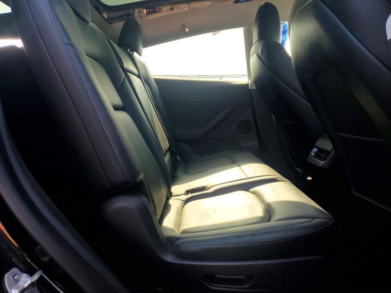 Photo 11 from auction – 2022 TESLA MODEL Y with VIN 7SAYGAEE1NF488721