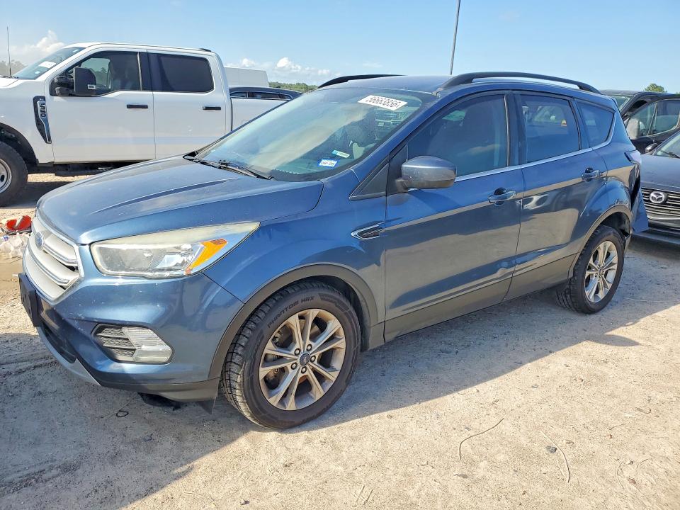 FORD ESCAPE 2018 with VIN 1FMCU9GD6JUA99296 - Photo from auction