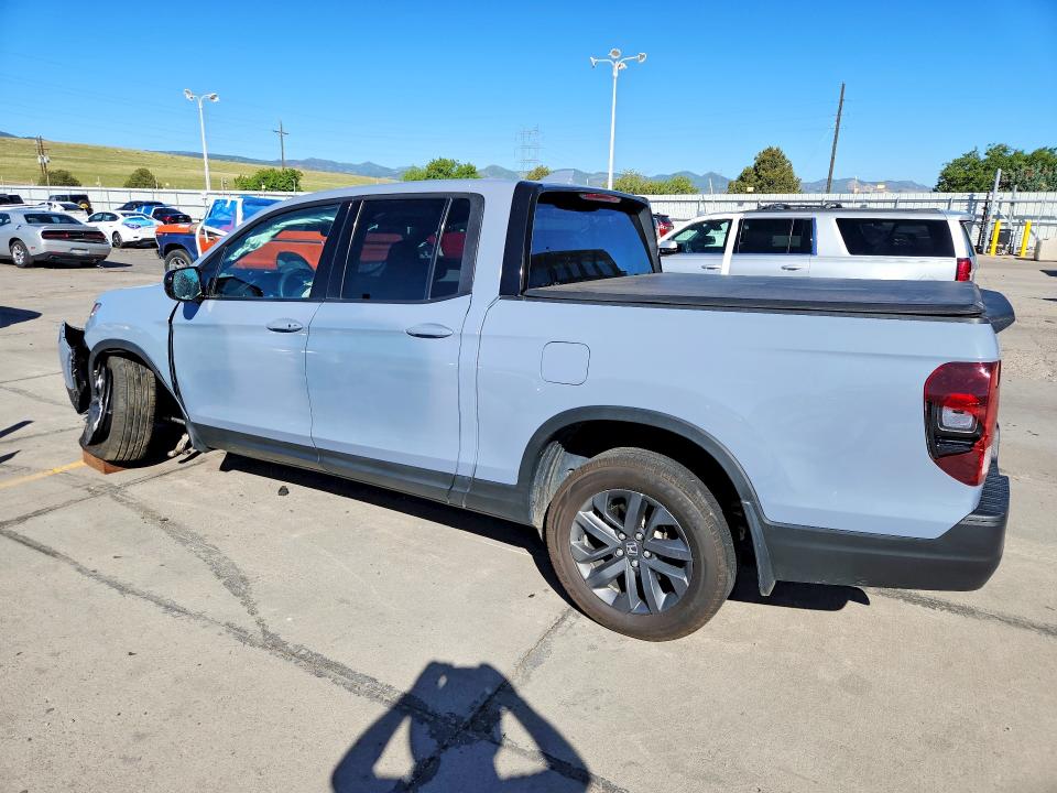 Photo 2 from auction – 2023 HONDA RIDGELINE with VIN 5FPYK3F18PB067947